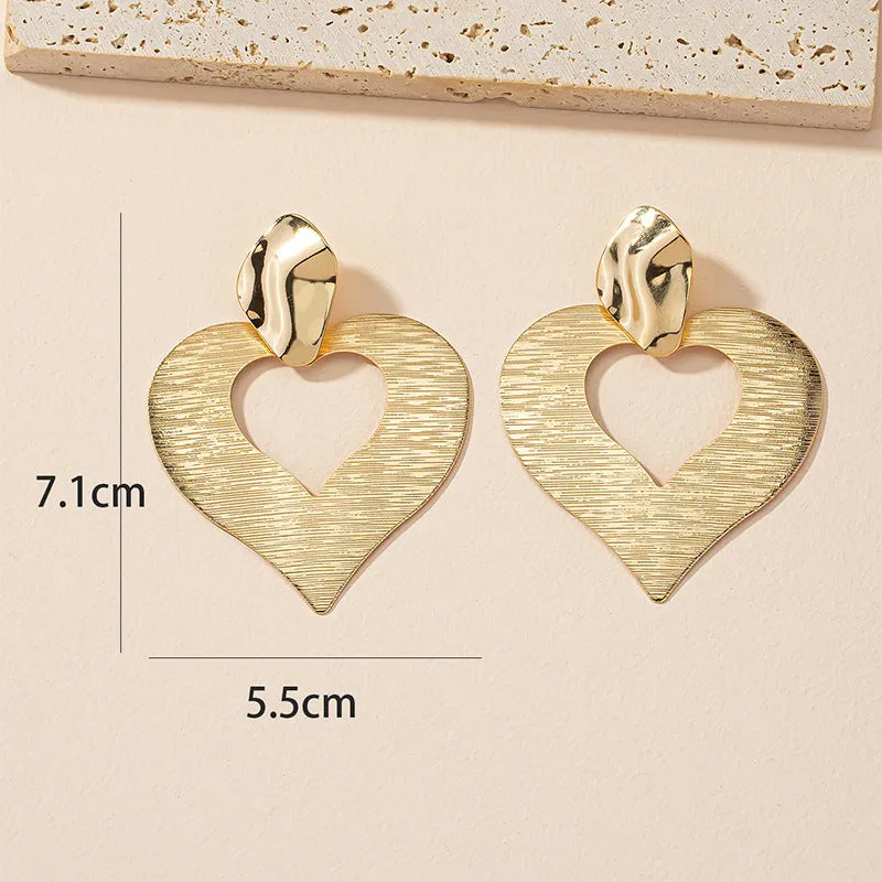 Peach Heart Hollow Stud Earrings with a Unique Design for Street Style Photographers