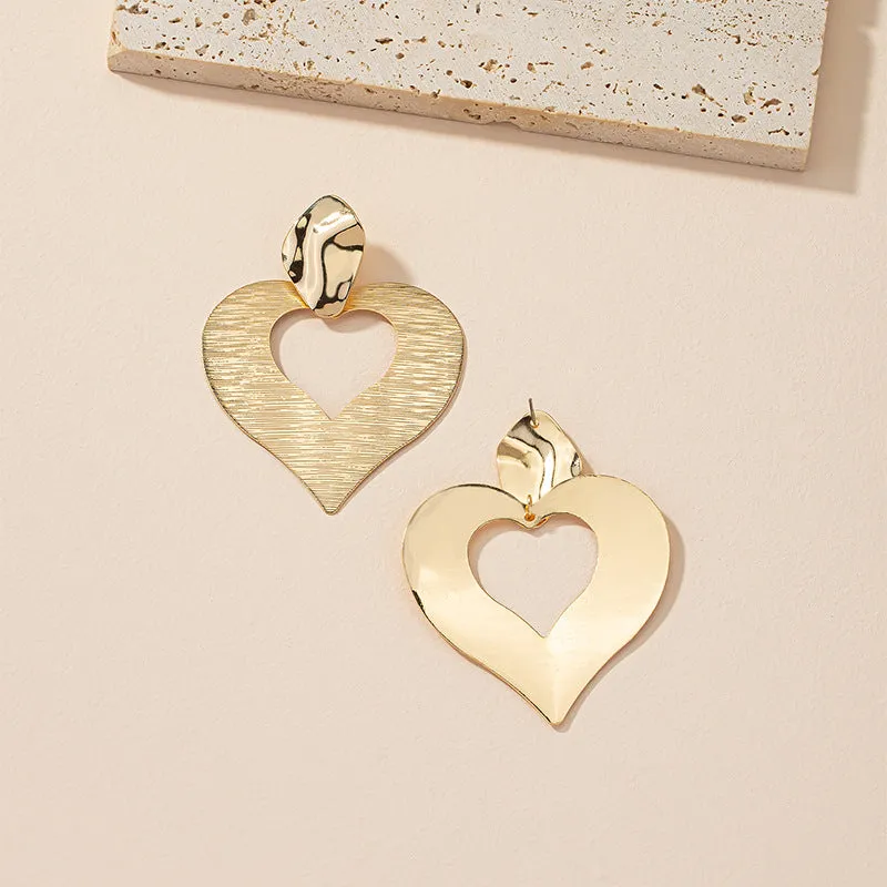Peach Heart Hollow Stud Earrings with a Unique Design for Street Style Photographers