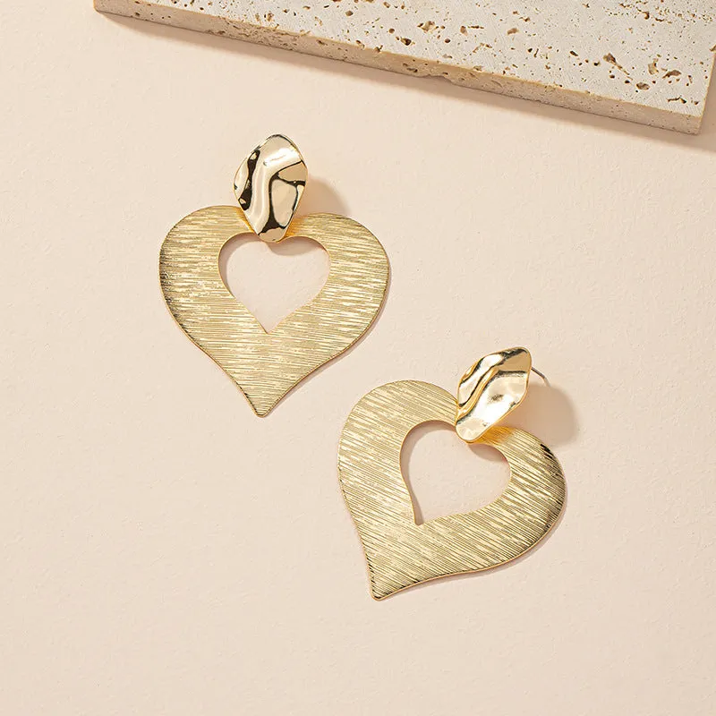 Peach Heart Hollow Stud Earrings with a Unique Design for Street Style Photographers